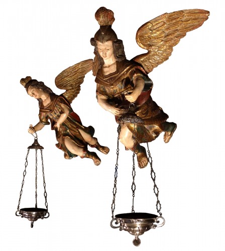 Pair of polychrome angels with silver lamps, early 19th century