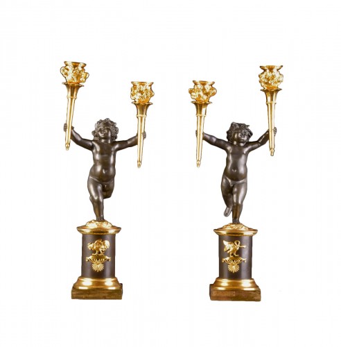 A pair of Empire gilt and patinated bronze candelabra