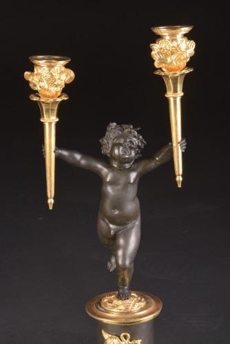 Empire - A pair of Empire gilt and patinated bronze candelabra