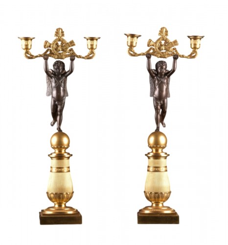 Pair of patinated and gilt bronze two-light candelabra 