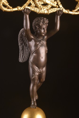 Antiquités - Pair of patinated and gilt bronze two-light candelabra 