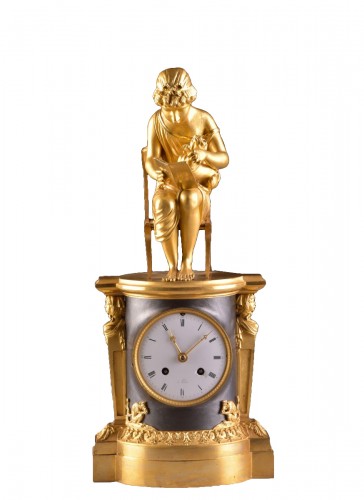 A beautiful bronze gilt &amp; patinated &quot;Child reading&quot; Empire clock, ca. 1810
