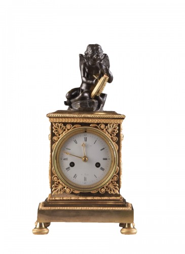 A French Empire mantel clock with putti 