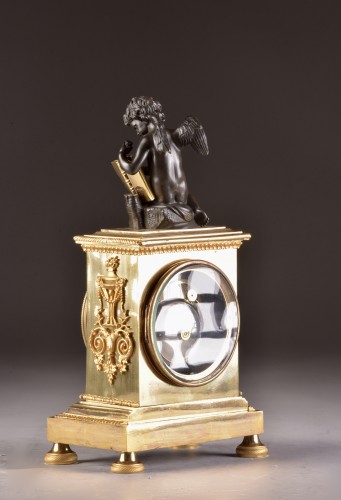 A French Empire mantel clock with putti  - Empire