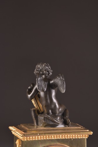 Antiquités - A French Empire mantel clock with putti 