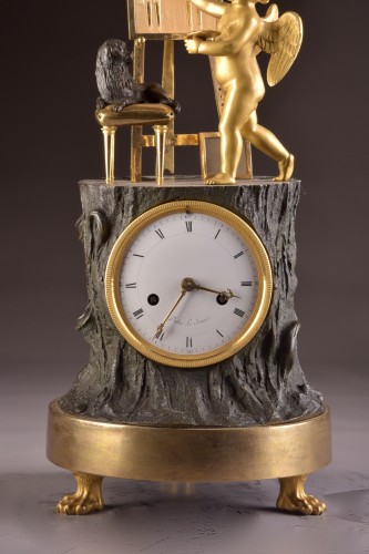 A gilt French bronze Empire clock “ Cupid as Artist” - Horology Style Empire