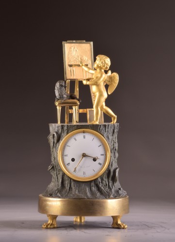 Horlogerie Pendule - « Cupidon artiste » pendule Empire en bronze doré