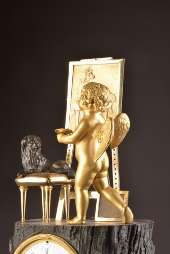 A gilt French bronze Empire clock “ Cupid as Artist” - 