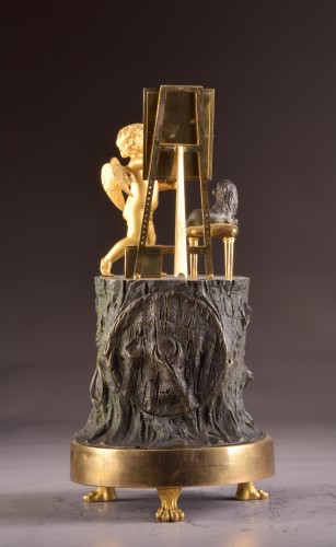XVIIIe siècle - « Cupidon artiste » pendule Empire en bronze doré
