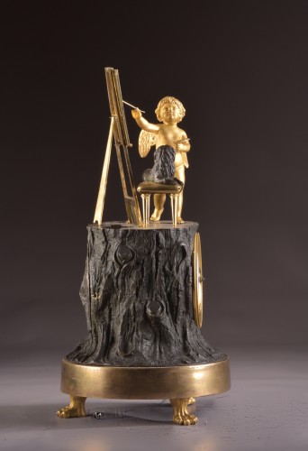A gilt French bronze Empire clock “ Cupid as Artist” - Empire
