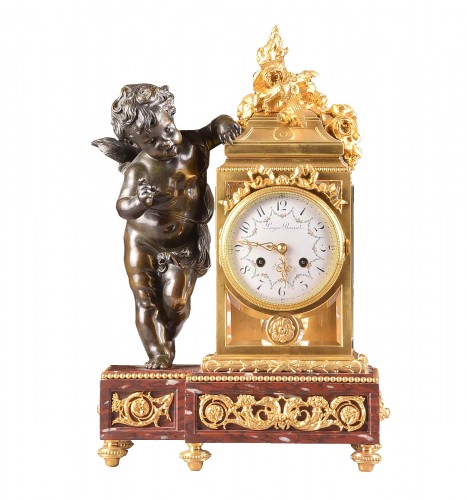 Pendule Napoléon III en bronze doré et bronze patiné à putto
