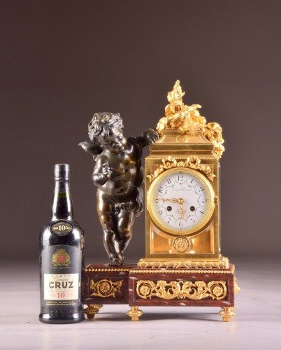 A Napoleon III ormolu and patinated bronze mantel clock with putto  - Horology Style Napoléon III