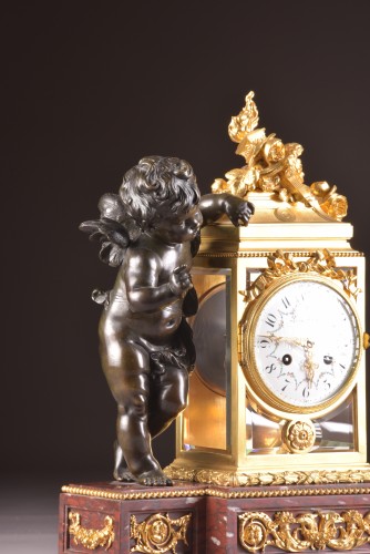 A Napoleon III ormolu and patinated bronze mantel clock with putto  - Napoléon III