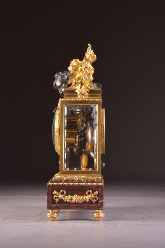 Antiquités - Pendule Napoléon III en bronze doré et bronze patiné à putto