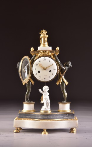 XVIIIe siècle - Pendule de cheminée en bronze patiné Louis XVI