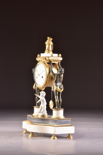 Louis XVI - A louis xvi patinated bronze figural mantel clock