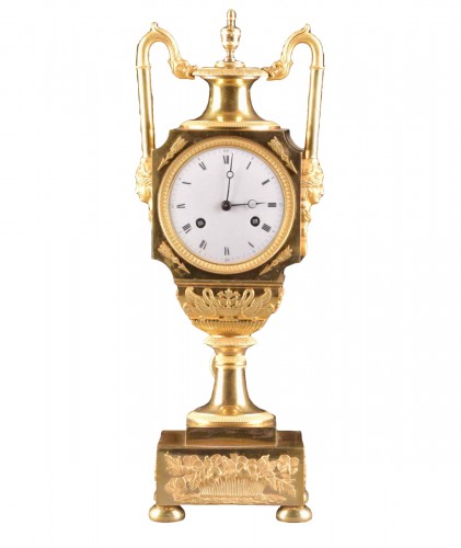 A French fire-gilt Empire vase mantel clock