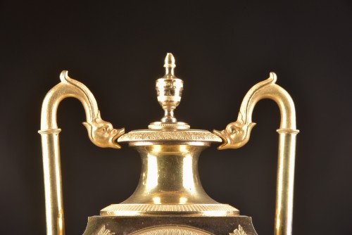 A French fire-gilt Empire vase mantel clock - 