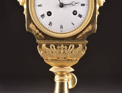 19th century - A French fire-gilt Empire vase mantel clock