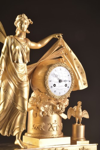 Antiquités - A large fire-gilt bronze Empire clock