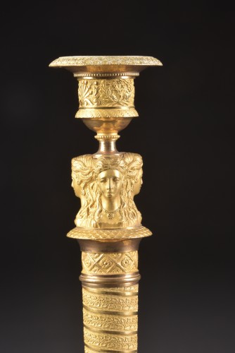 Lighting  - A pair of gilded bronze Empire candlesticks