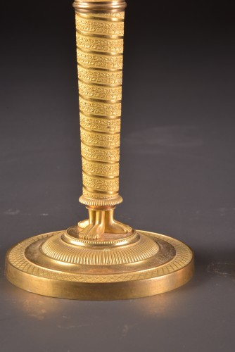 Empire - A pair of gilded bronze Empire candlesticks