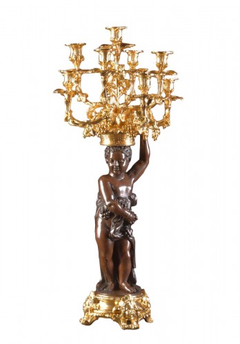 An exceptionally imposing bronze figurative Candelabra