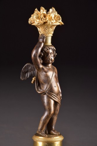 Lighting  - Elegant Louis XVI figural candlesticks with cupid figures