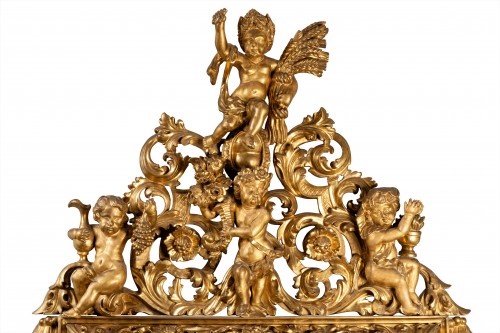 18th century - Early 18th century Italian carved gilt wood mirror depicting four seasons