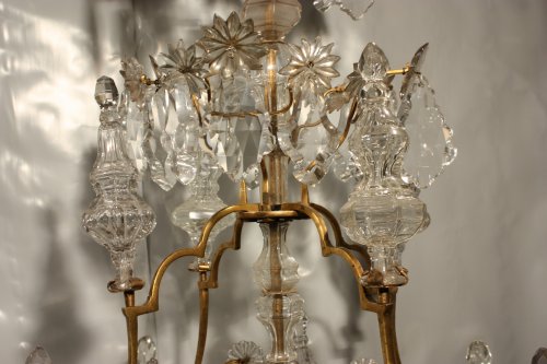 Antiquités - A Louis XV mid-18th c. gilt-bronze mounted crystal chandelier