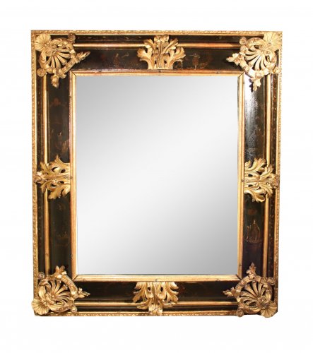 A late 17th c. Venetian lacquer and gilt wood mirror