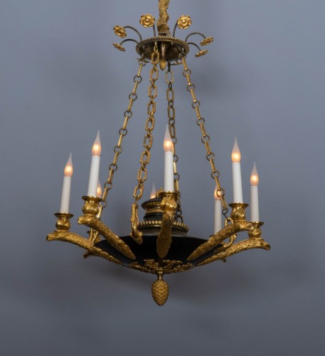 Lighting  - An Empire gilt and patinated bronze eight-light chandelier