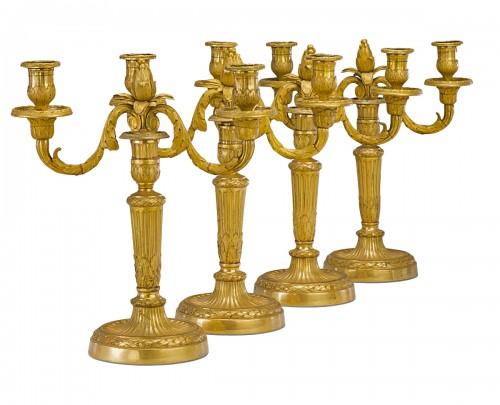 Ensemble de quatre candélabres Louis XVI à deux lumières en bronze doré