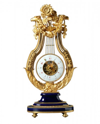 Louis XVI gilt bronze and Sèvres porcelain skeletonised lyre clock