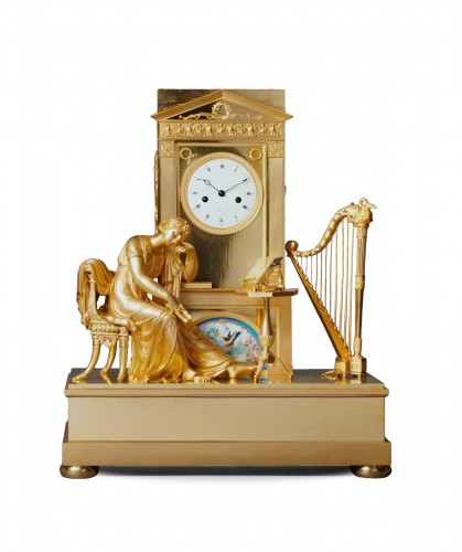 An Empire gilt bronze mantel clock with a Paris porcelain by Boileau