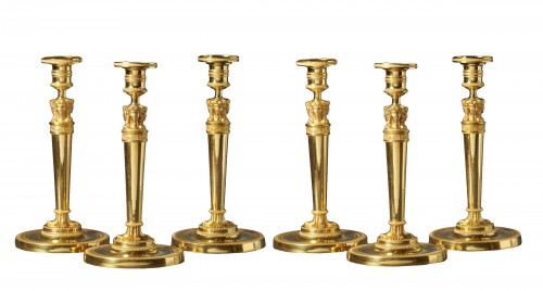 A set of six Empire gilt bronze figural candlesticks