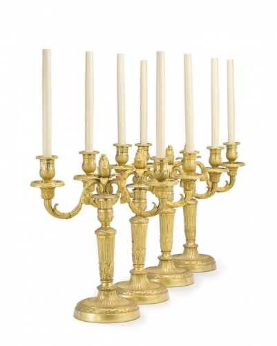 Lighting  - A set of four Louis XVI gilt bronze two-light candelabra after Delafosse