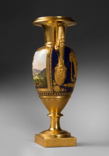 Porcelain & Faience  - A pair of Restauration gilt and polychrome two-handled vases