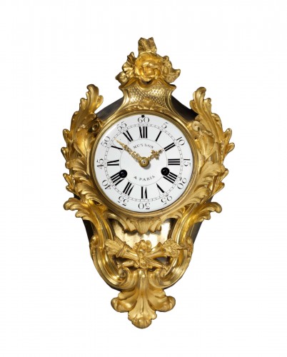 A late Louis XV gilt bronze clock by Pierre Musson