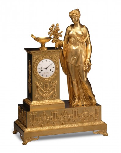 An Empire mantle clock signed on the white enamel dial Lesieur à Paris