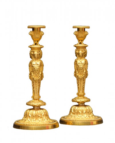 A pair o bronze candlesticks circa 1820 after a model by Jean-Démosthène Dugourc