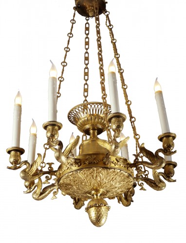 An Empire eight-light chandelier with eight swan-neck branches