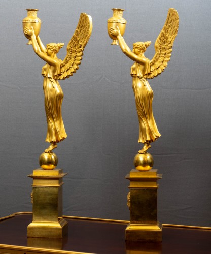 Lighting  - A pair of Empire figural gilt bronze three light candelabra