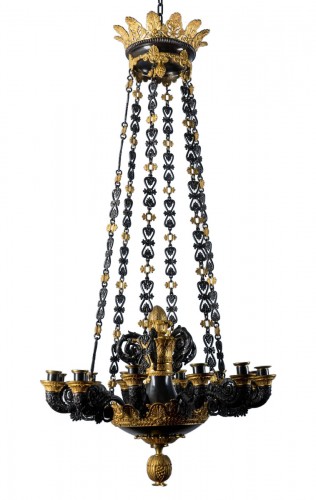 A Charles X Gilt And Patinated Bronze Twelve-Light Chandelier