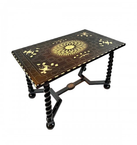 An 18th Century Central Table In Ebonized Wood And Inlaid With Bone.