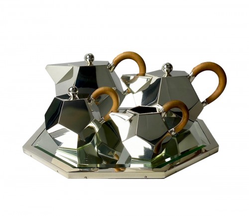 A rare mid-20th century modernist silver and wood coffee and tea service.
