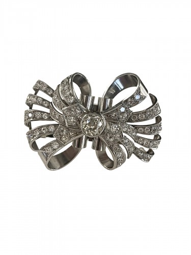 Double clip formant broche en or et diamants