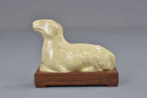 Asian Works of Art  - Cream coloured ceramic Dog, Tang Dynasty 618-907