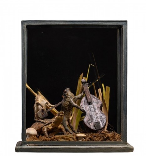 A cased taxidermy display of the Toad and Frog orchestra  playing music