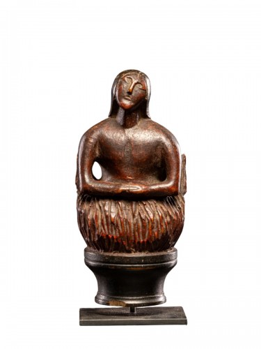Wooden folkart figure,depicting stylized feminine soul burning in Purgatory